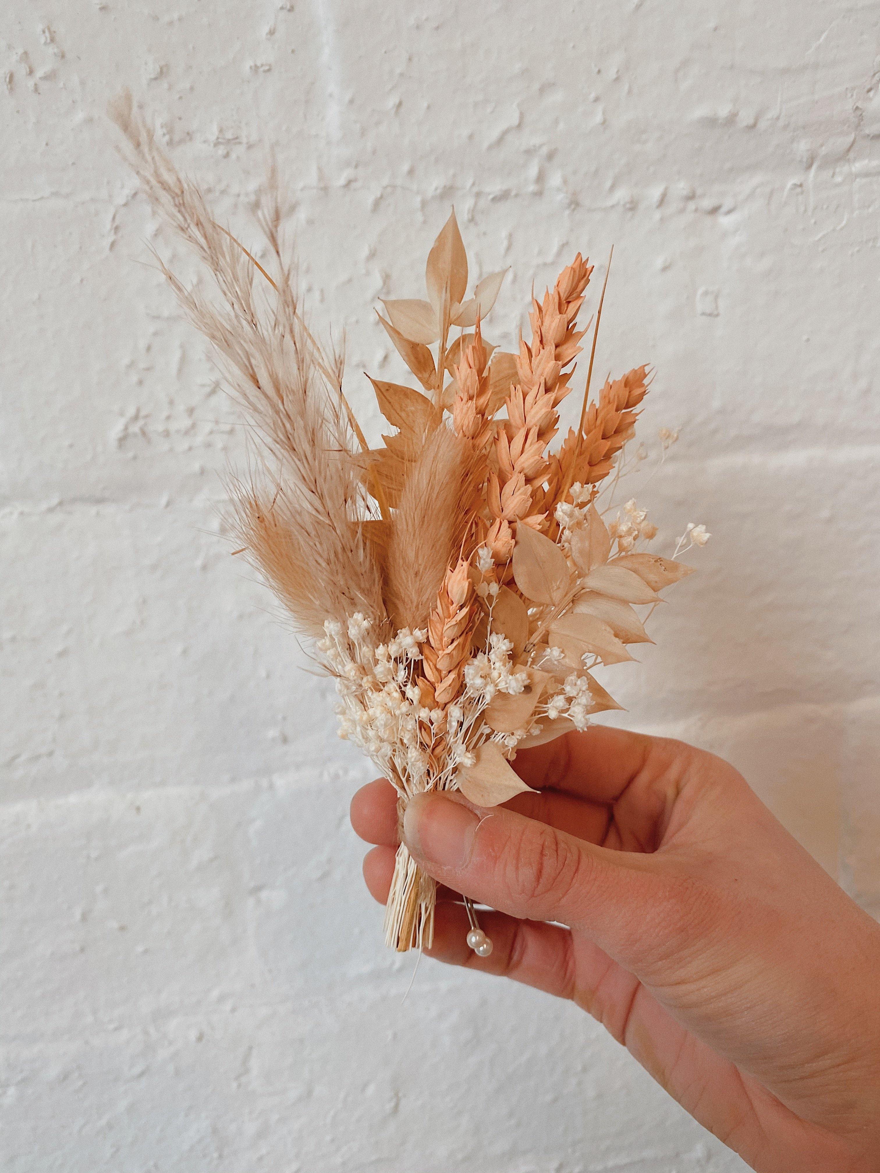 Dried floral pin on newest boutonnieres